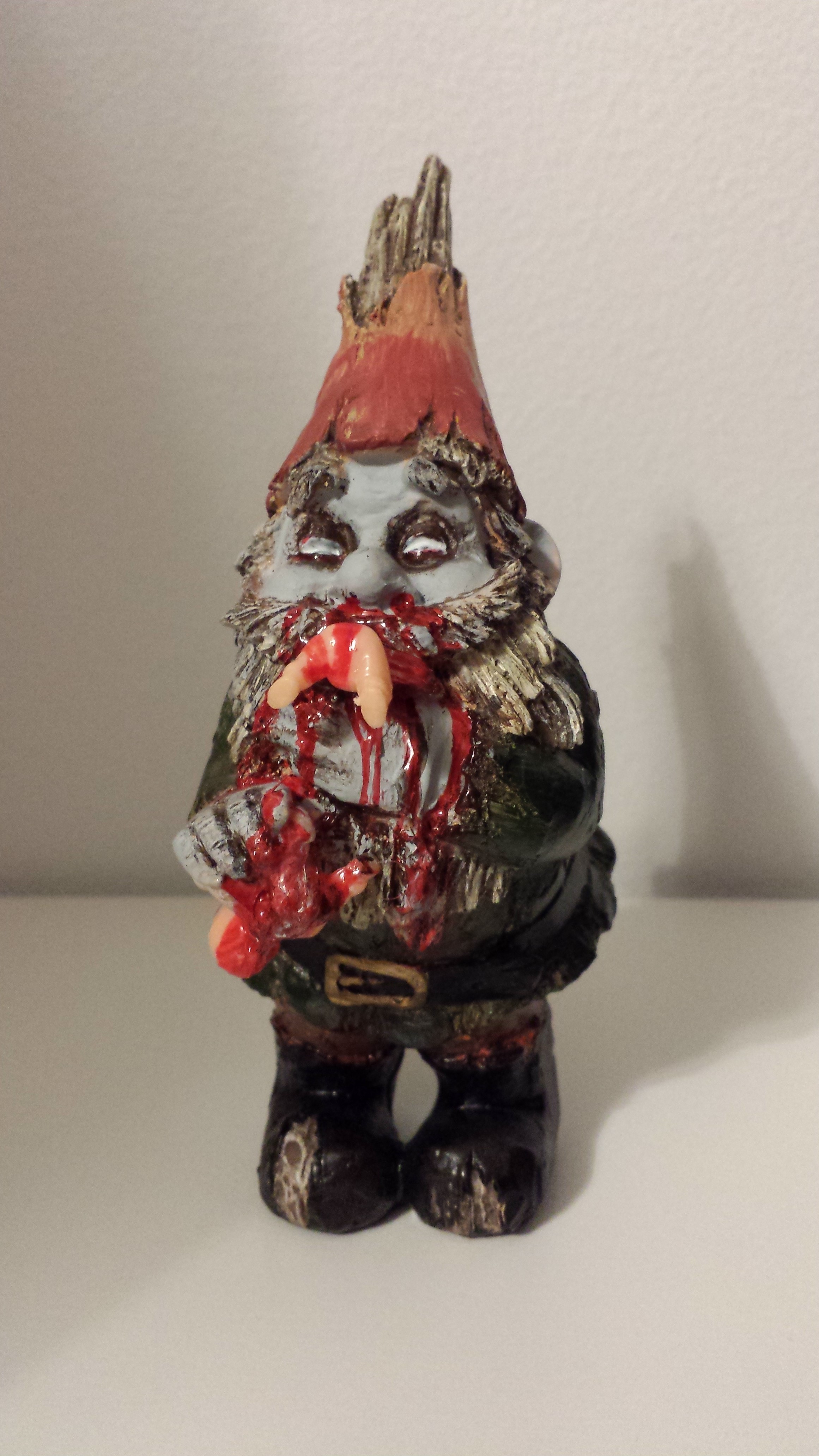 Gnomes protect your flowers...by eating the babies that crawl by! Another gory custom from Curious Goods.