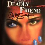 Kristy Swanson signs cover of "Deadly Friend" DVD
